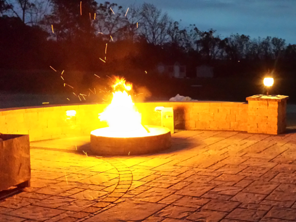 back patio with outdoor fireplace