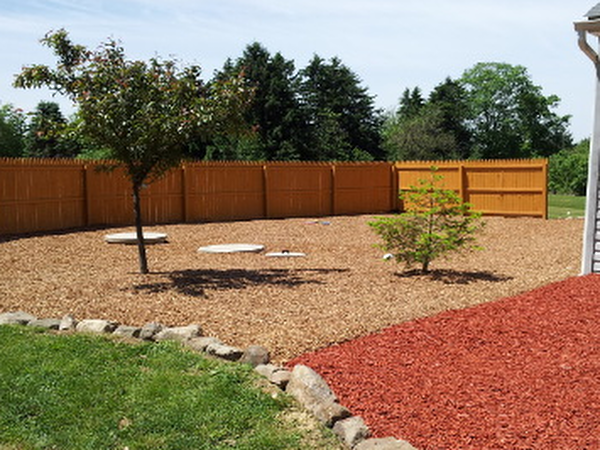 red and tan gravel edging with rocks