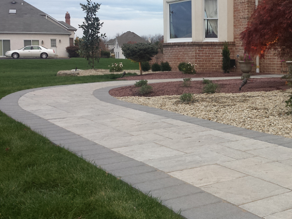 front yard walkway with landscaping and rocks