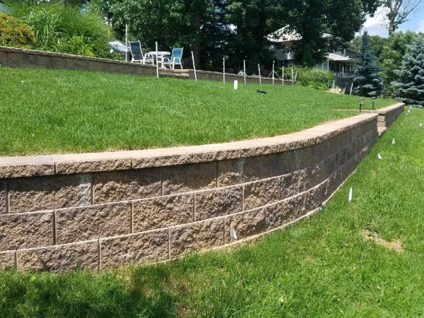 backyard retention wall with landscaping