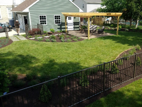 backyard with custom edging and lawn maintenance