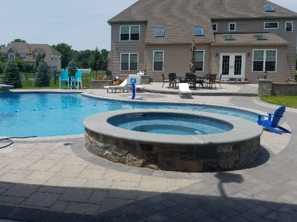 pool side view of backyard patio