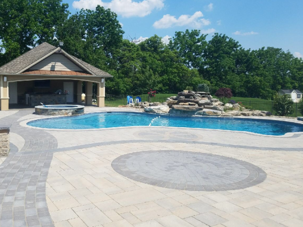 large back patio design around pool and hottub 