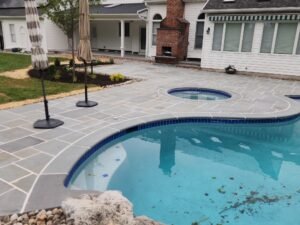 pool with paver patio