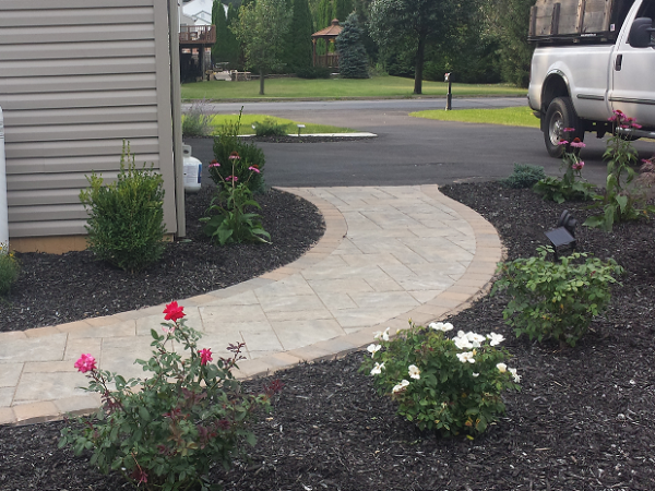 paver sidewalk with landscape design